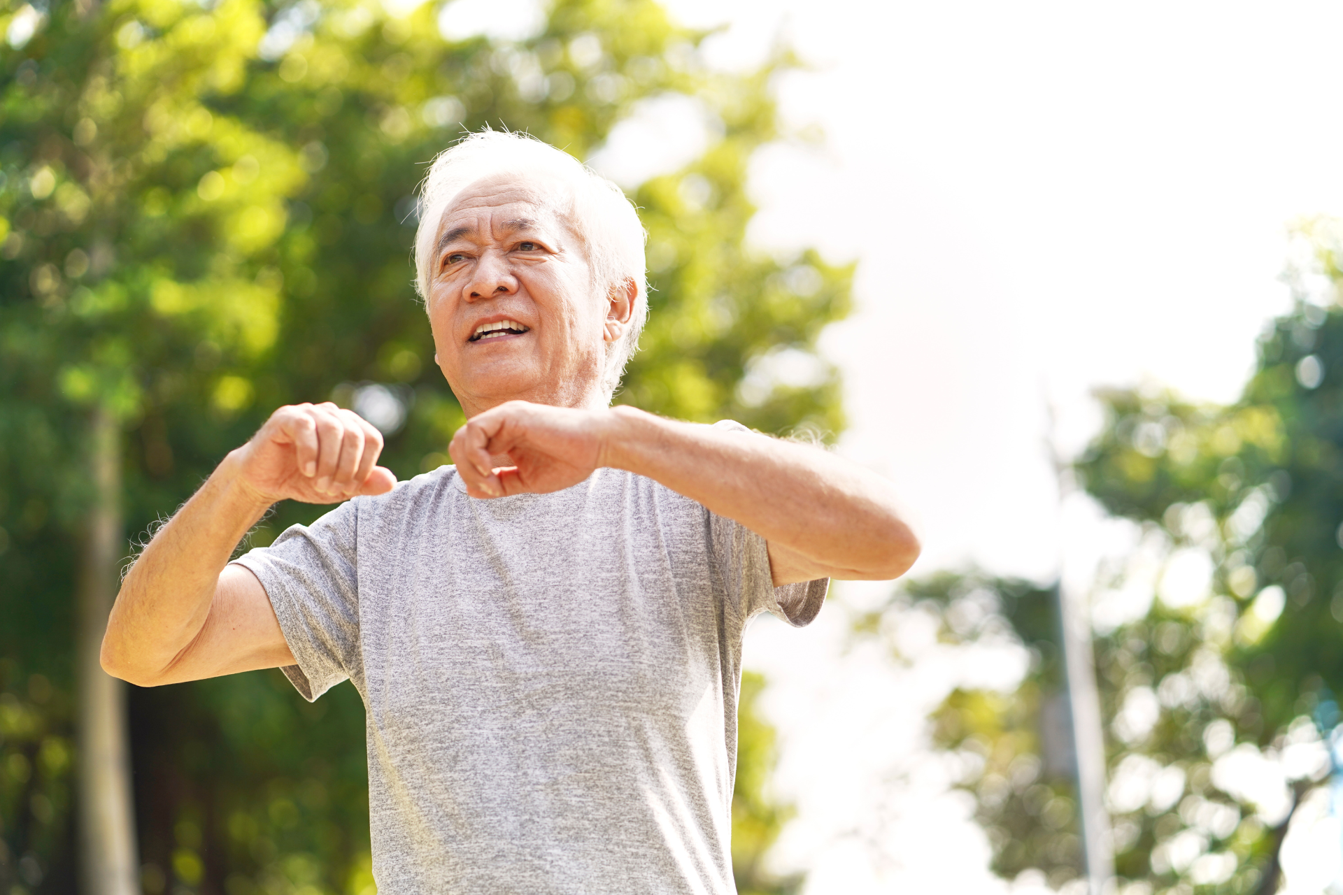 Elderly man exercising outdoors