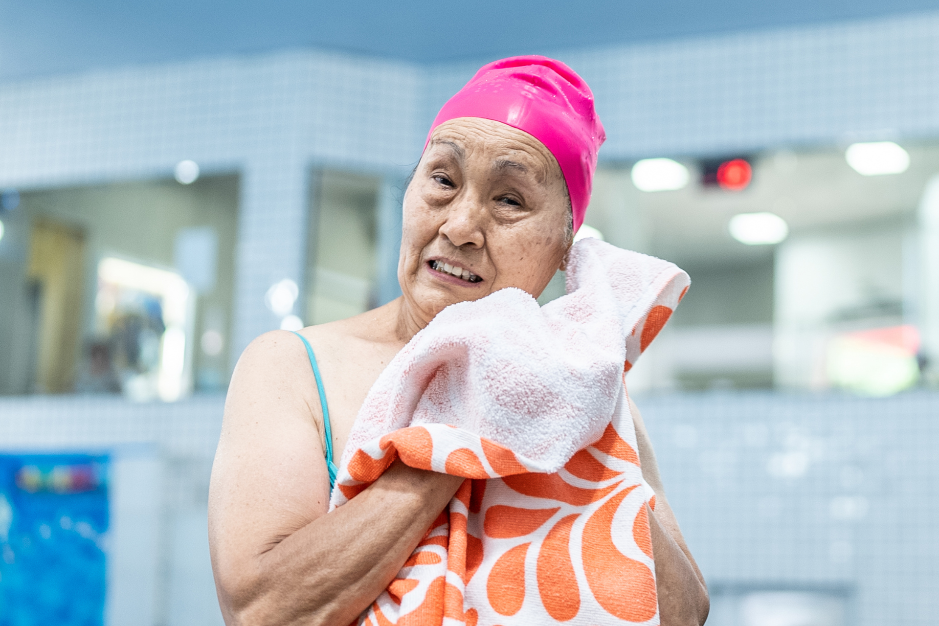 Preventing Pus in the Ear Elderly lady drying her ear with a towel