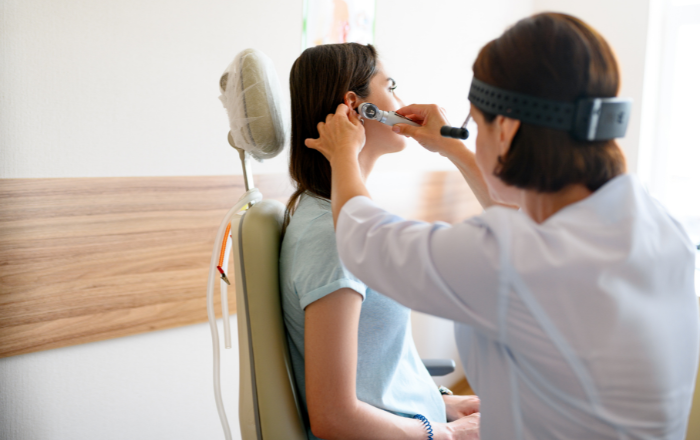 Woman getting her ears checked